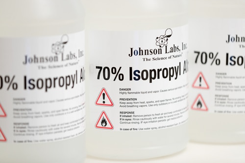 A closeup of the bottle label of an isopropyl alcohol.