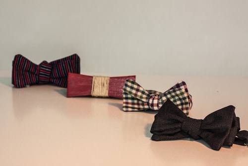four assorted baby bowties