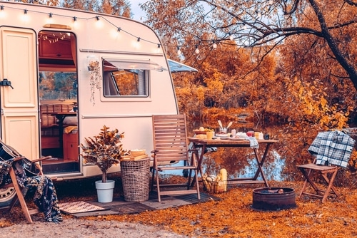 A van house camping during autumn.