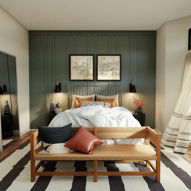 A simple but chic bedroom with white linens, olive colored french wall and a wooden foot bench