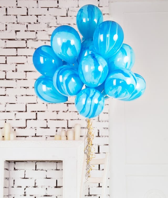 A marble candy styled blue helium balloons