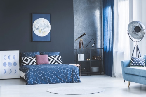 A blue themed bedroom interior.