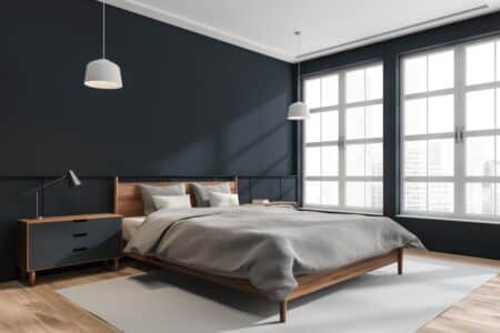 spacious bedroom with dark and gray color theme
