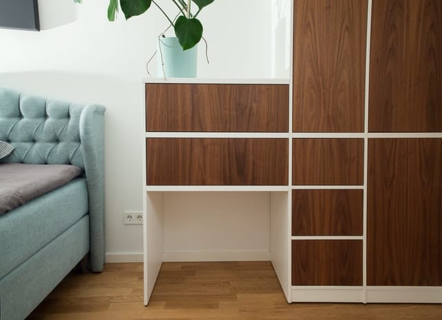 Two-toned wooden built-in cabinet.