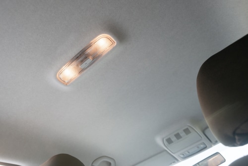 A warm ceiling light of a car interior