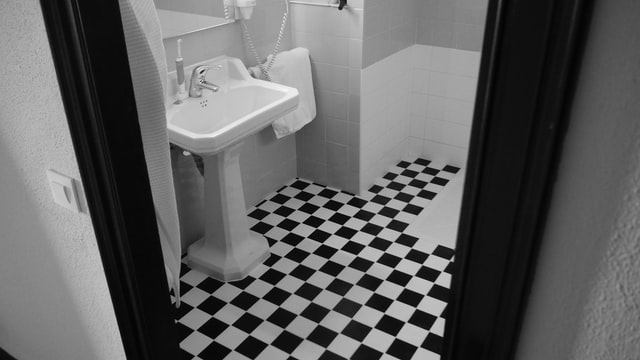 A black and white bathroom chessboard tiles