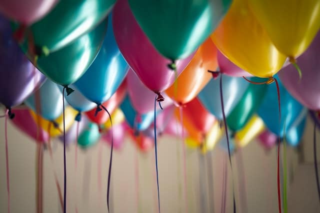 bunch of colorful balloons inside the room