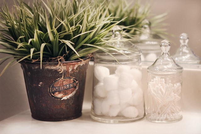 cotton balls and q tips in glass jars