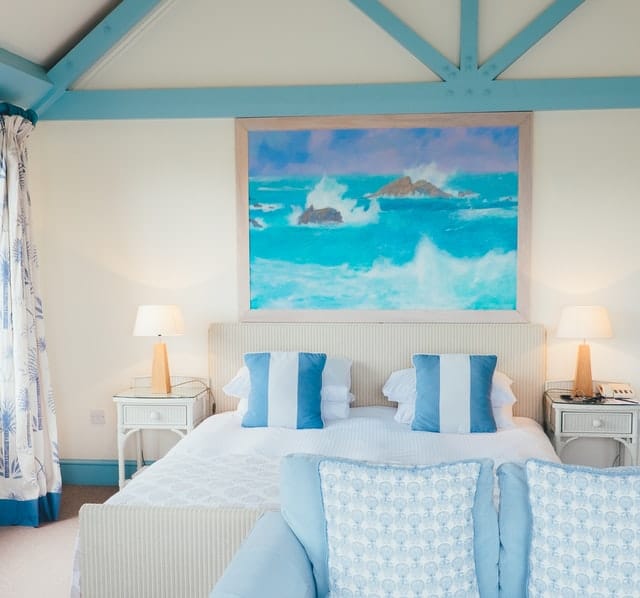 A dreamy themed bedroom using bright colors such as blue and white.