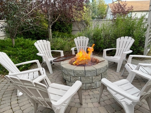 a round firepit in the backyard