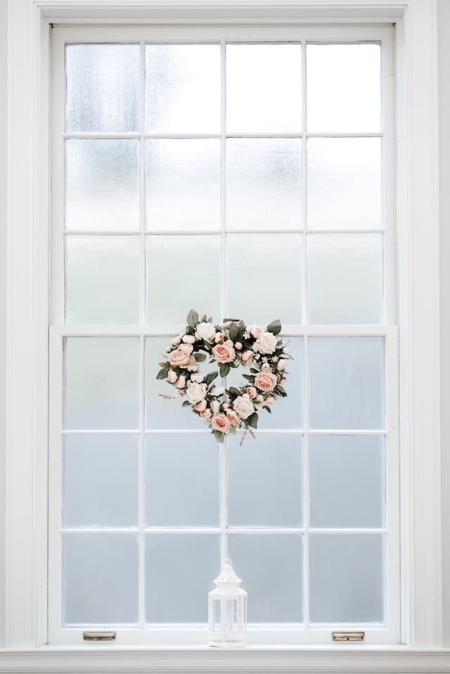 hearth wreath in a white french window