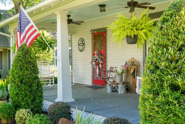 front porch a USA flag hanging on the front porch