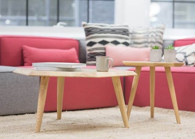 Two complementary geometrically shaped coffee tables.