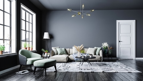 Living room with coordinated tones of gray for floor and walls.
