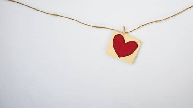 a heart craft hanging on a yarn