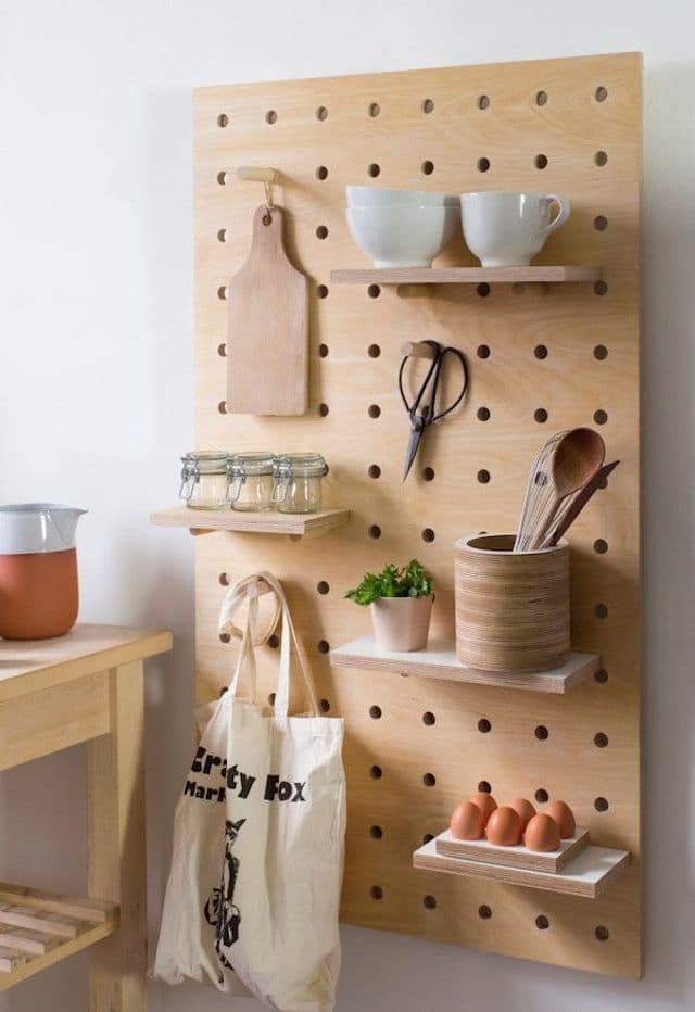 kitchen utensils and shelves on pegboard