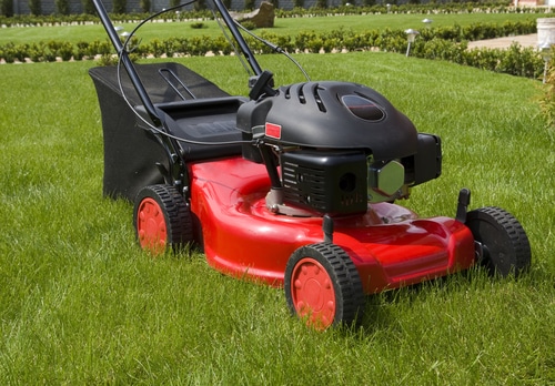 red lawnmower to be used in the garden