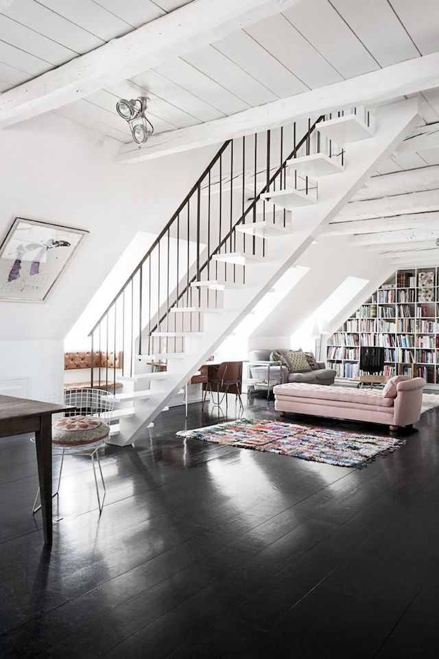Library A reading space with a pink daybed and white walls.