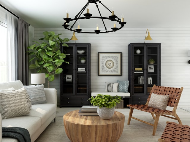 A simple living room with black and wooden elements on furniture and decor.