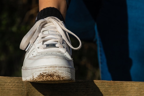 A muddy white Air Force 1 shoes