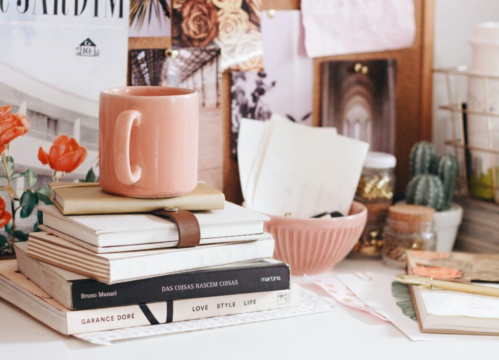Mug on top of books. a mug on top of books can actually add a very cozy feel to a room.