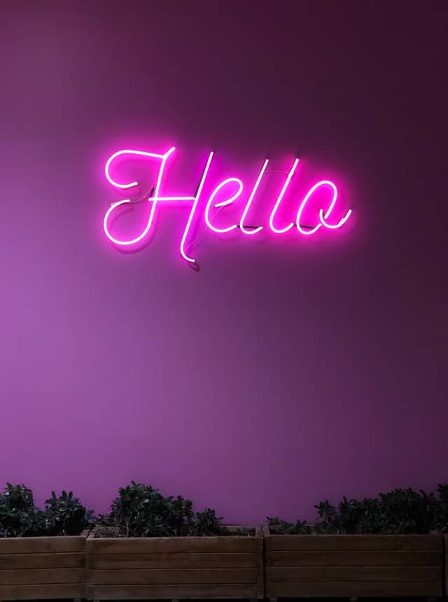 Pink neon light signage Hello