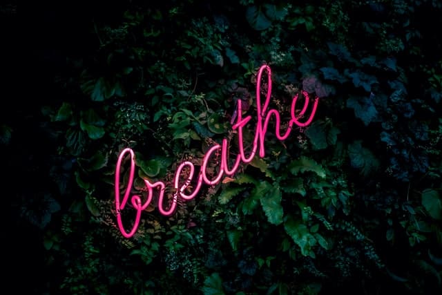 breathe neon word sign