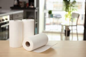 Three paper towel rolls on top of a table