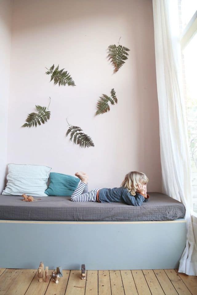 Pink wall Pink wall creates a very airy and unique vibe to a kids room.