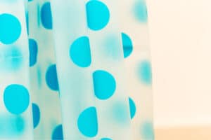 a blue polka dots shower curtain