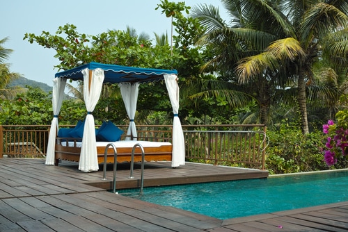 A tropical cabana setup beside the pool.