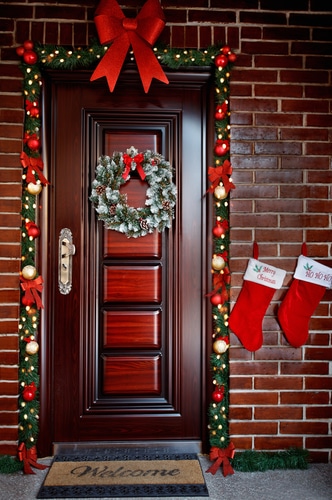 Santa christmas stockings hung at the front door