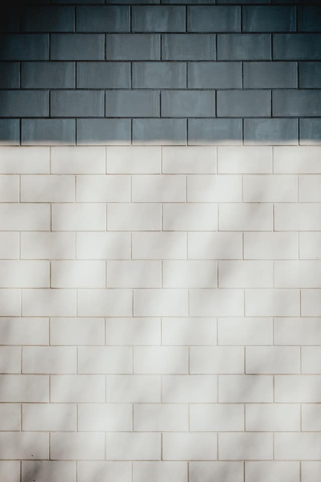 A wall of classic plain gray bricks.