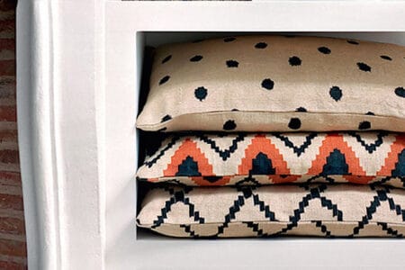 Sezane patterned pillows that add energy to a room