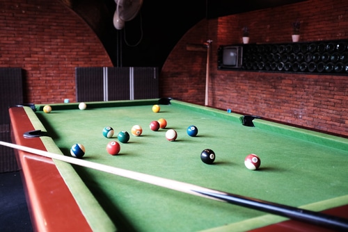 Billiard balls scattered on a pool table