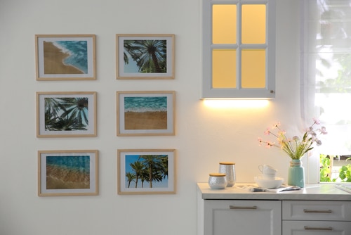 A gallery wall of summer and beach photos.