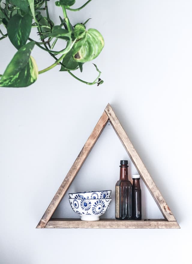triangle wall frame A textured wooden triangle frame as a floating shelf