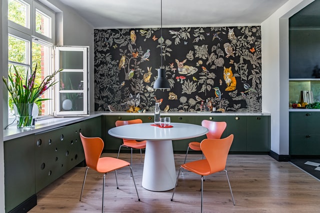 A nature themed black wallpaper installed in the dining room focus wall.
