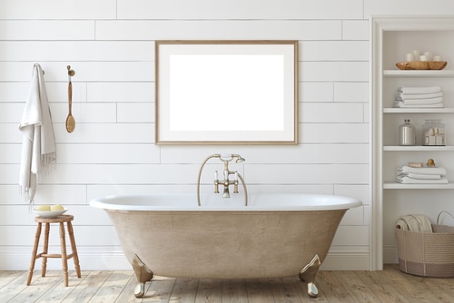 A minimal bathroom using a white shiplap walls and neutral textures for styling.