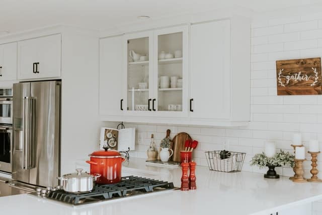 all white kitchen counters and cabinetries