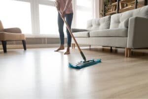woman mopping a laminated wooden floor
