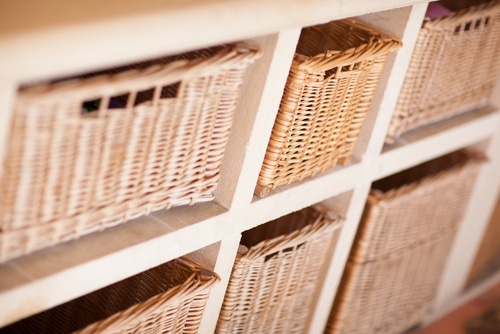 A set of wooden shelf baskets.