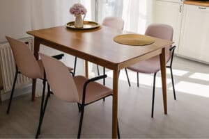 Wooden dining set with pink chairs
